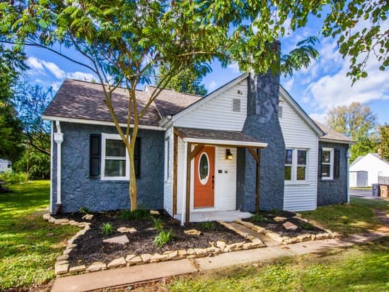 Completed cottage exterior with refreshed entry and landscaping