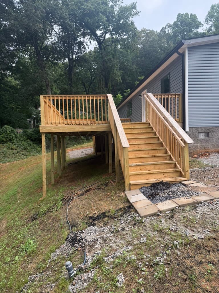 Rear wood deck and stairs at the Island Ford modular home project