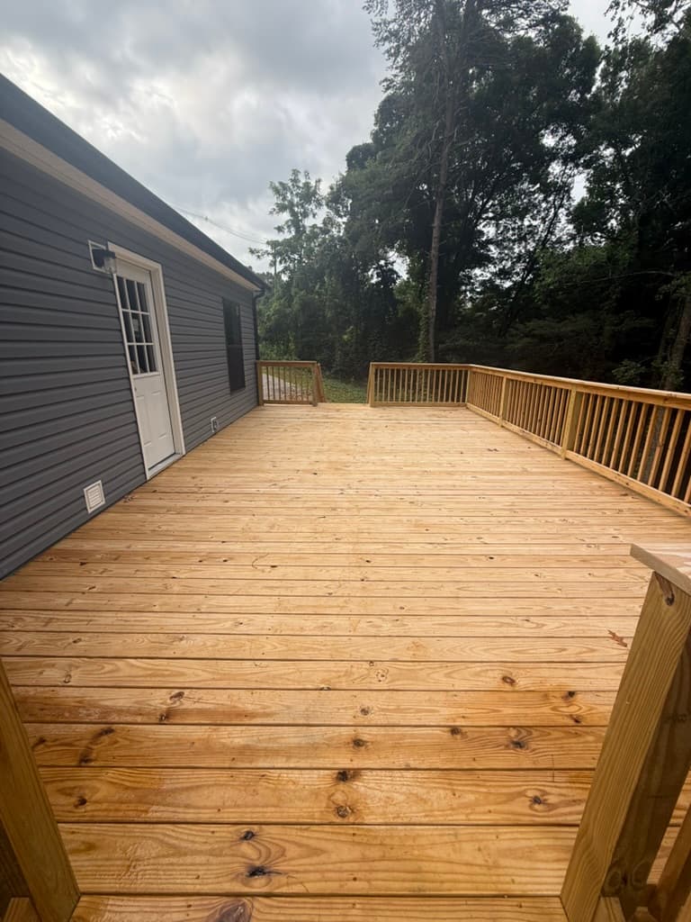 Finished deck running alongside the modular home