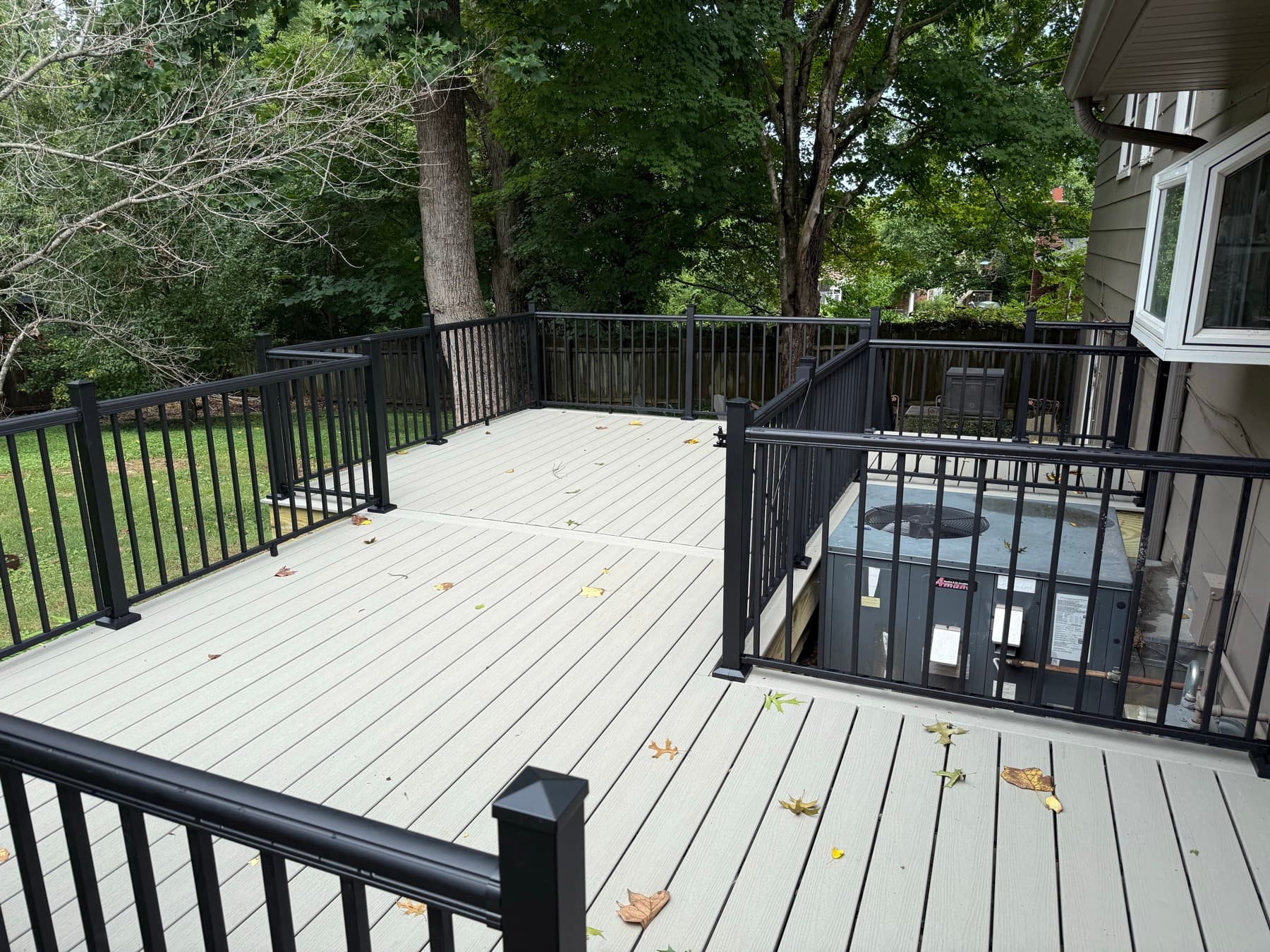 Trex deck surface with coordinated black aluminum railing