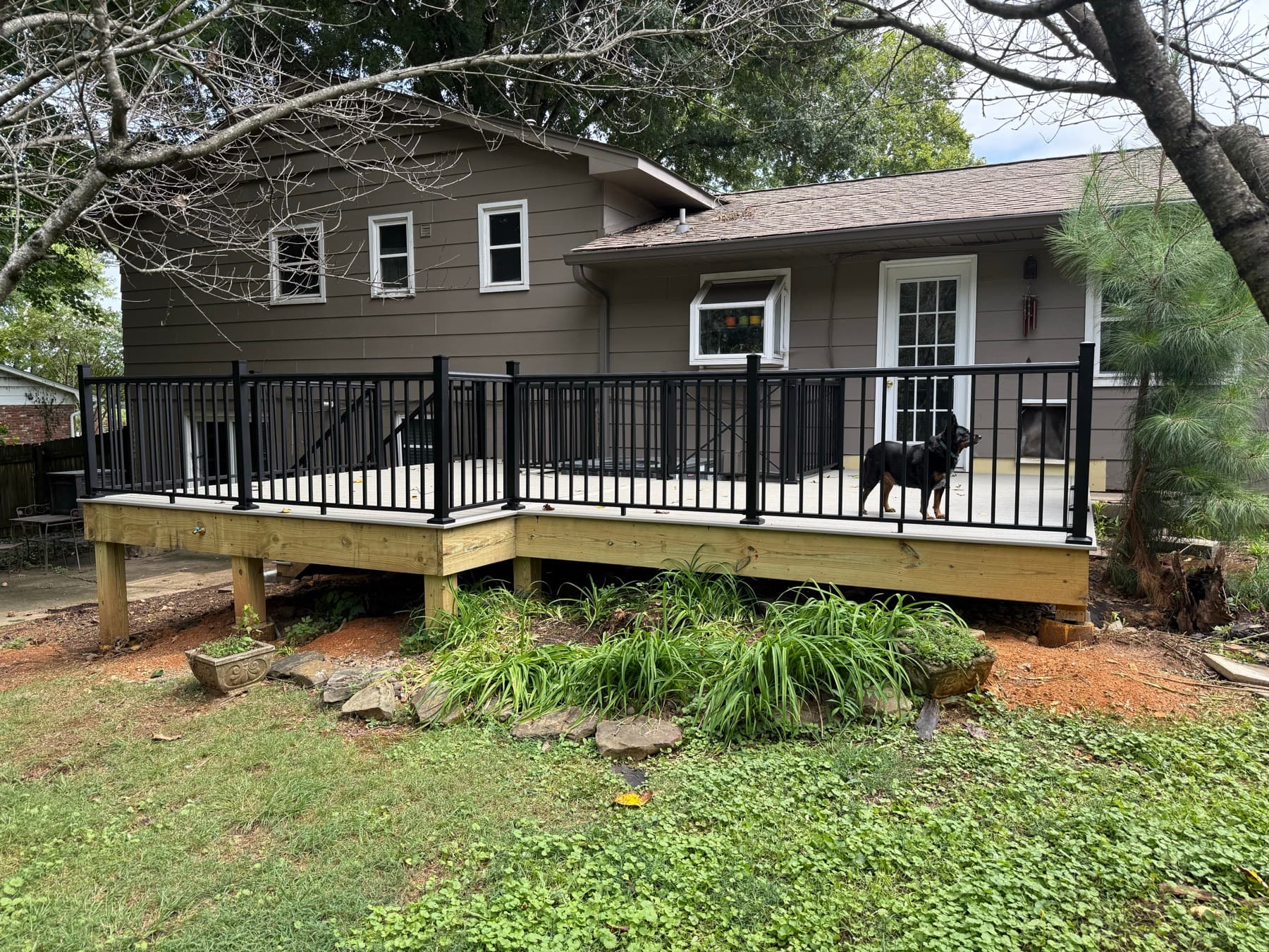 Wide front view of the completed Trex deck and stair landing