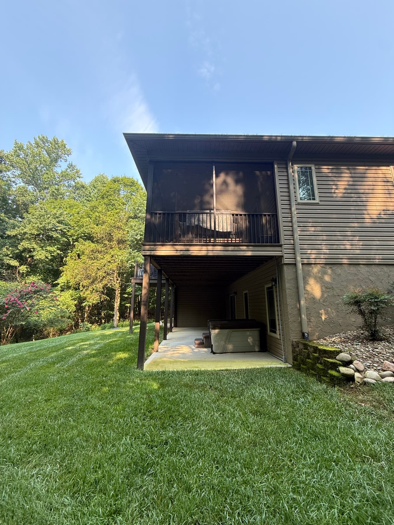 Portrait view of the completed elevated screened porch and stairs