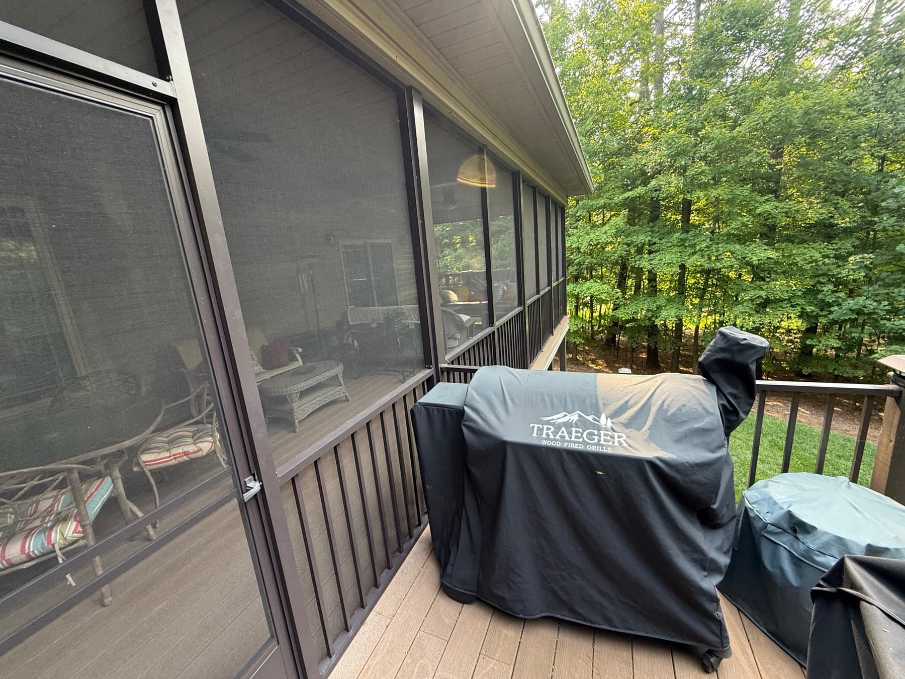 Screen wall and grill area where the open deck meets the porch