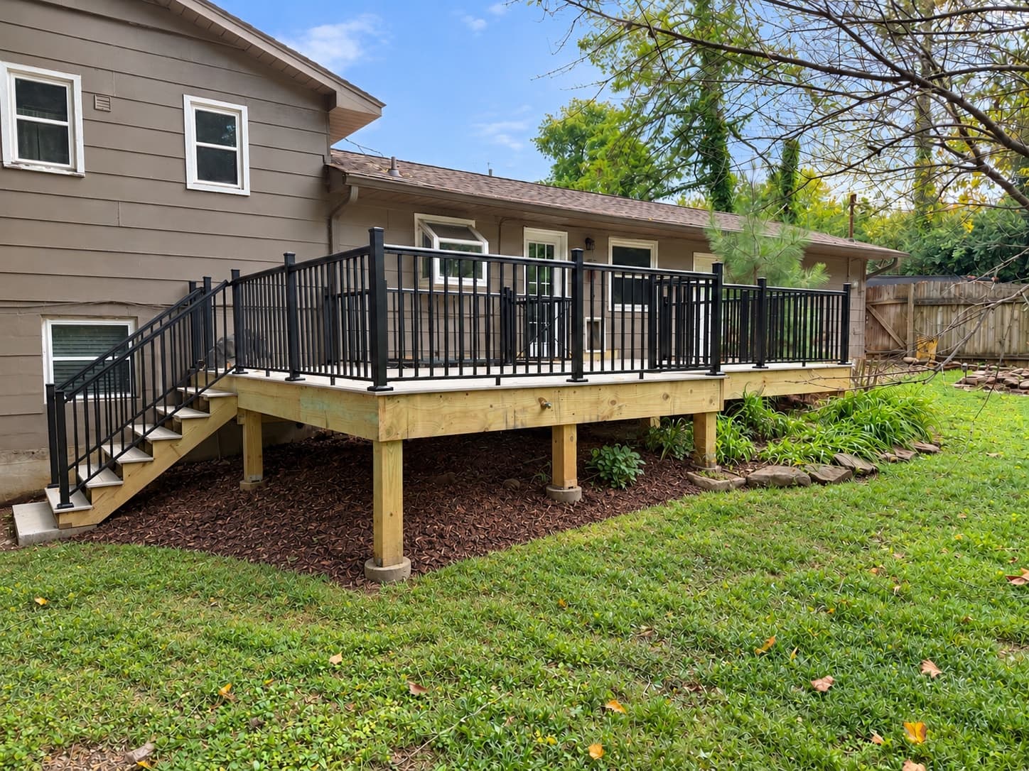 Completed single-level Trex deck with black aluminum railing in Tellico Village