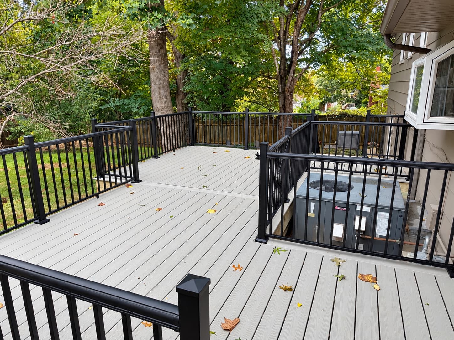 Trex deck surface with black aluminum railing