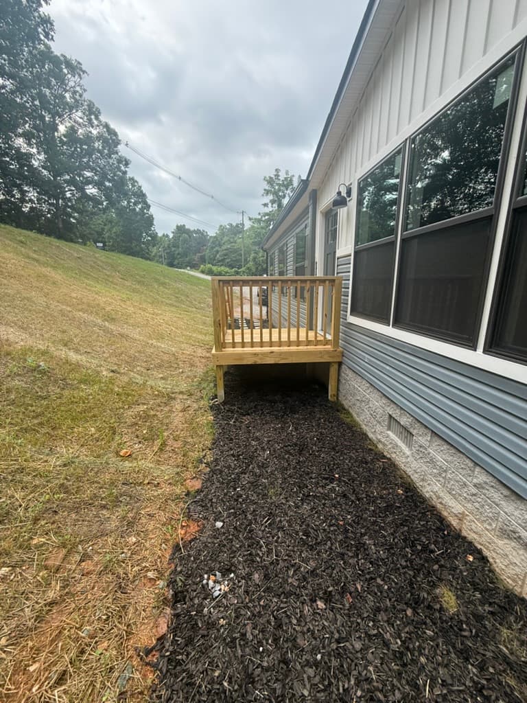 Side view of the entry deck beside the completed exterior